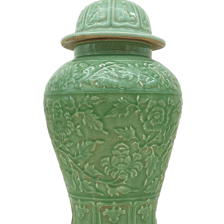 Green tall urn lamp with raised leaf and floral pattern